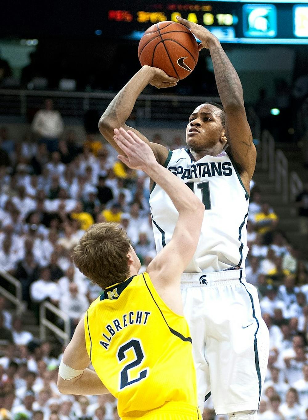 	<p>Junior guard Keith Appling makes a field goal attempt in the second half of the game against Michigan, Tuesday at Breslin Center. Justin Wan/The State News</p>