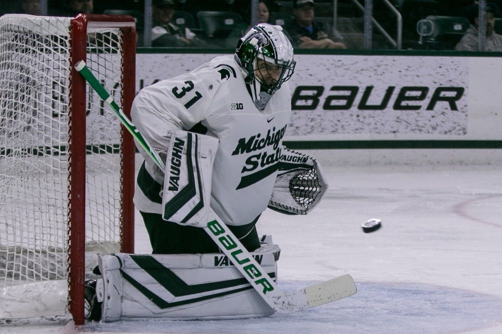 <p>Senior goalie John Lethemon (31) saves a shot during the game against Western Ontario at Munn Ice Arena on Oct. 7, 2019. The Spartans defeated the Mustangs, 6-1.</p>