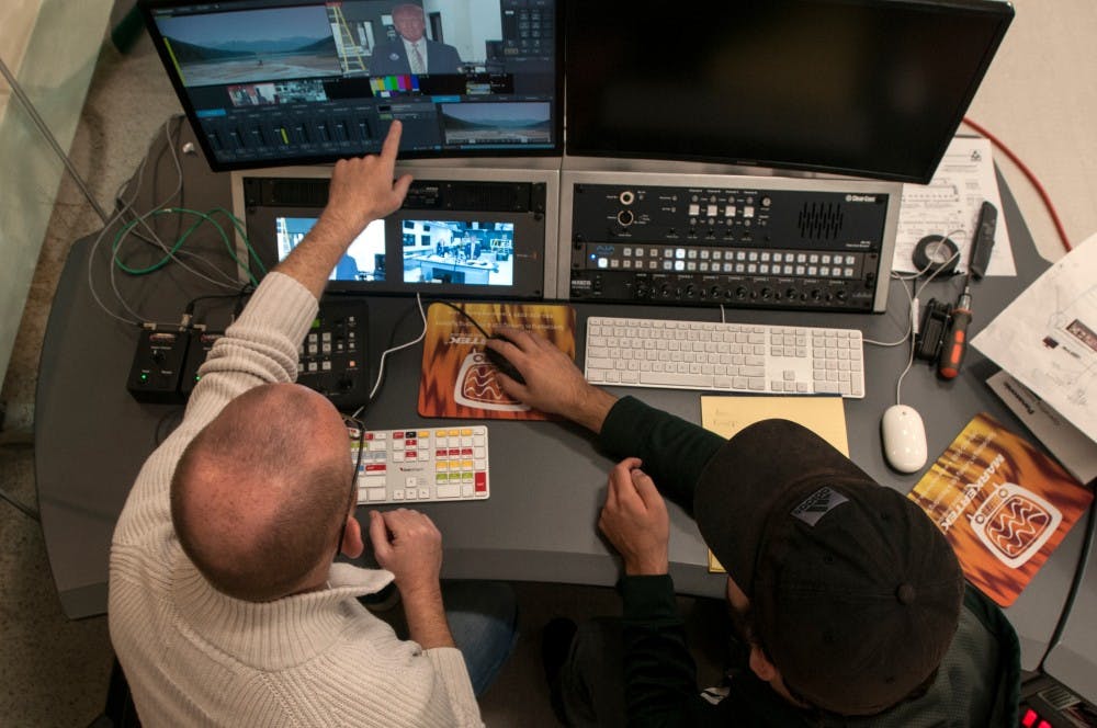 Professor of practice Troy Hale, left, and media and information senior Nate Rivard test new camera systems on Oct. 26, 2016 in the Communication Arts and Sciences Building. The CAS building is in the process of building a new media center and studio. 