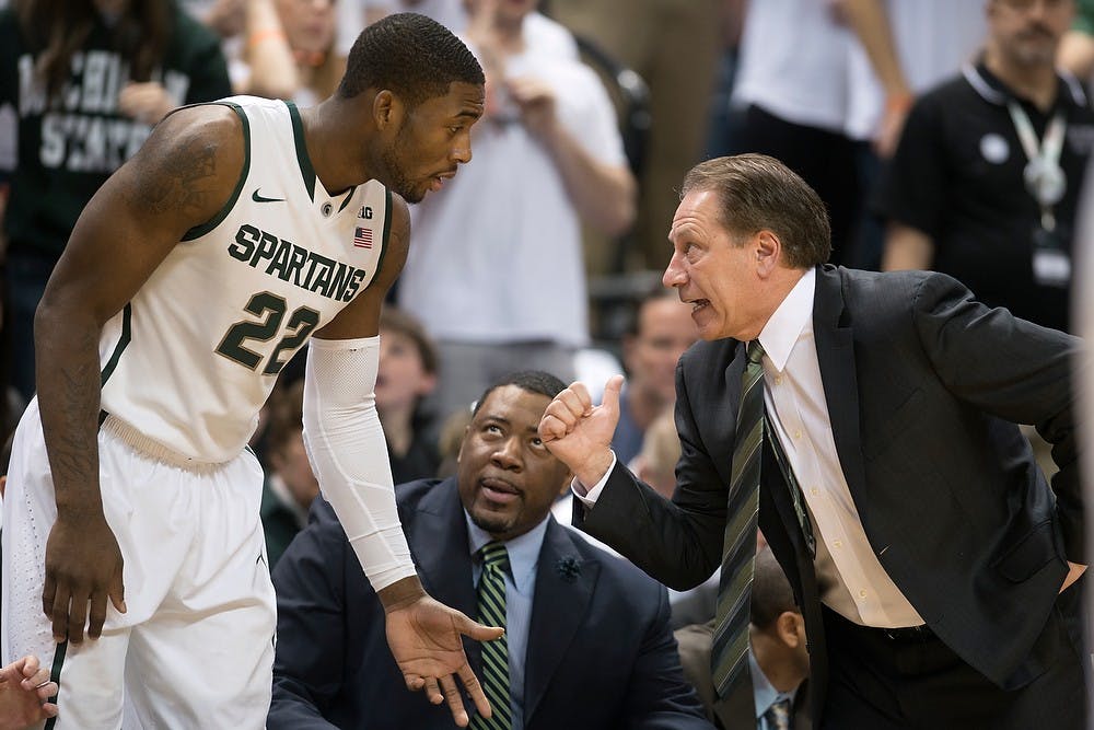 	<p>Head coach Tom Izzo talks to junior guard/forward Branden Dawson  Jan. 11, 2014, at Breslin Center during the game against Minnesota. The Spartans defeated the Gophers in overtime, 87-75. Julia Nagy/The State News</p>