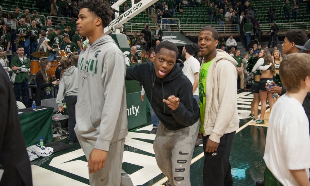 MSU recruits Miles Bridges, left, and Cassius Winston after the game against Ohio State on March 5, 2016 at Breslin Center. The Spartans defeated the Buckeyes, 91-76.