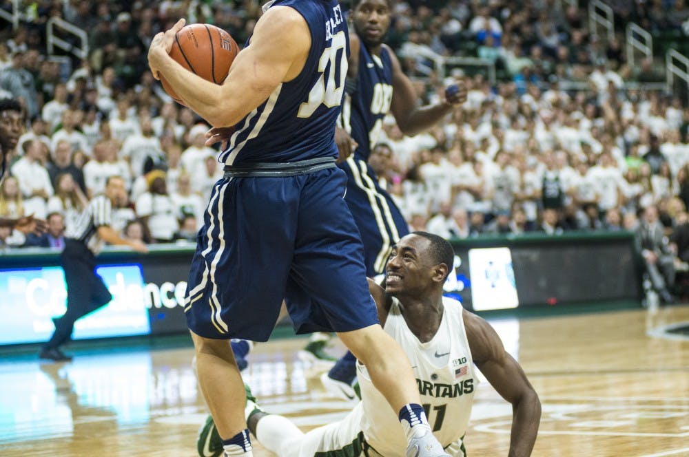 Junior guard Lourawls Nairn Jr. (11) reaches for the ball during the second half of the men's basketball game against Oral Roberts on Dec. 3, 2016 at Breslin Center. The Spartans defeated the Golden Eagles, 80-76.
