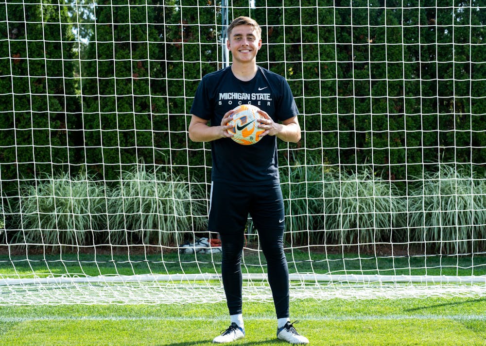 MSU men's soccer senior goalkeeper Owen Finnerty poses with a soccer ball at DeMartin field on Oct. 5, 2022. 