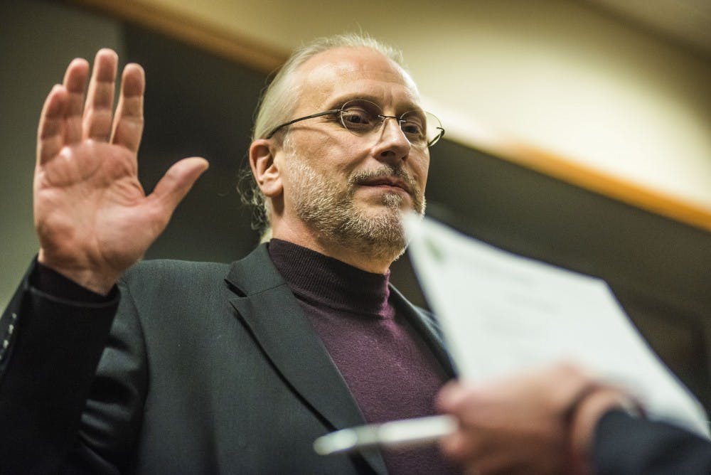 East Lansing council member Erik Altmann is sworn in as Mayor Pro Tem on Nov. 21, 2017 at the 54B District Court.