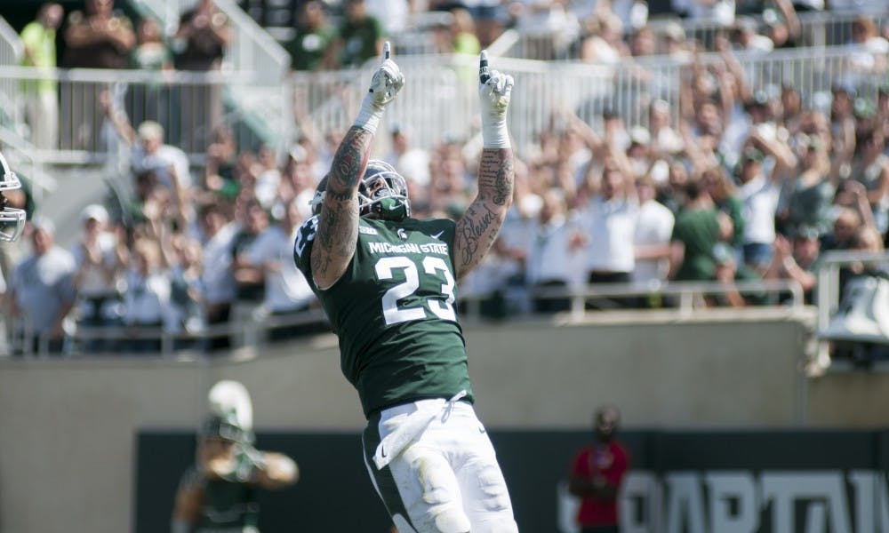 <p>Senior linebacker Chris Frey (23) celebrating in the end zone during the game against Bowling Green on Sep. 2, 2017, at Spartan Stadium. The Spartans defeated the Falcons, 35-10.</p>