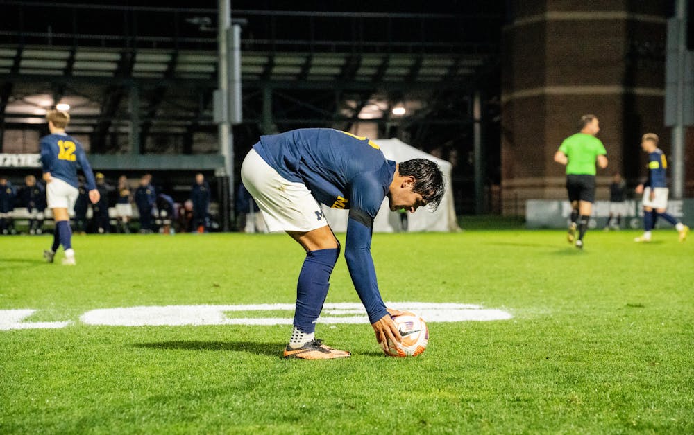 <p>University of Michigan junior midfielder Quin Rogers (6) prepares to take a free kick at DeMartin Stadium on Sept. 27, 2022. Spartans defeated the Wolverines 2-0. </p>