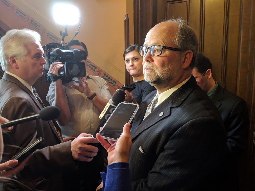 Senate Majority Leader Arlan Meekhof, R-West Olive, speaks to reporters outside the Senate chamber on Nov. 28.