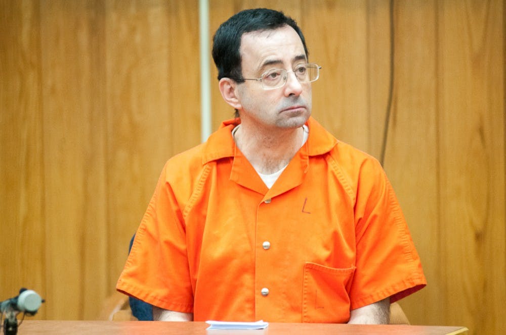 <p>Larry Nassar listens to Chief Judge Janice Cunningham on his third day of sentencing on Feb. 5, 2018, in the Eaton County courtroom. Nassar faces three counts of criminal sexual conduct in Eaton County.</p>