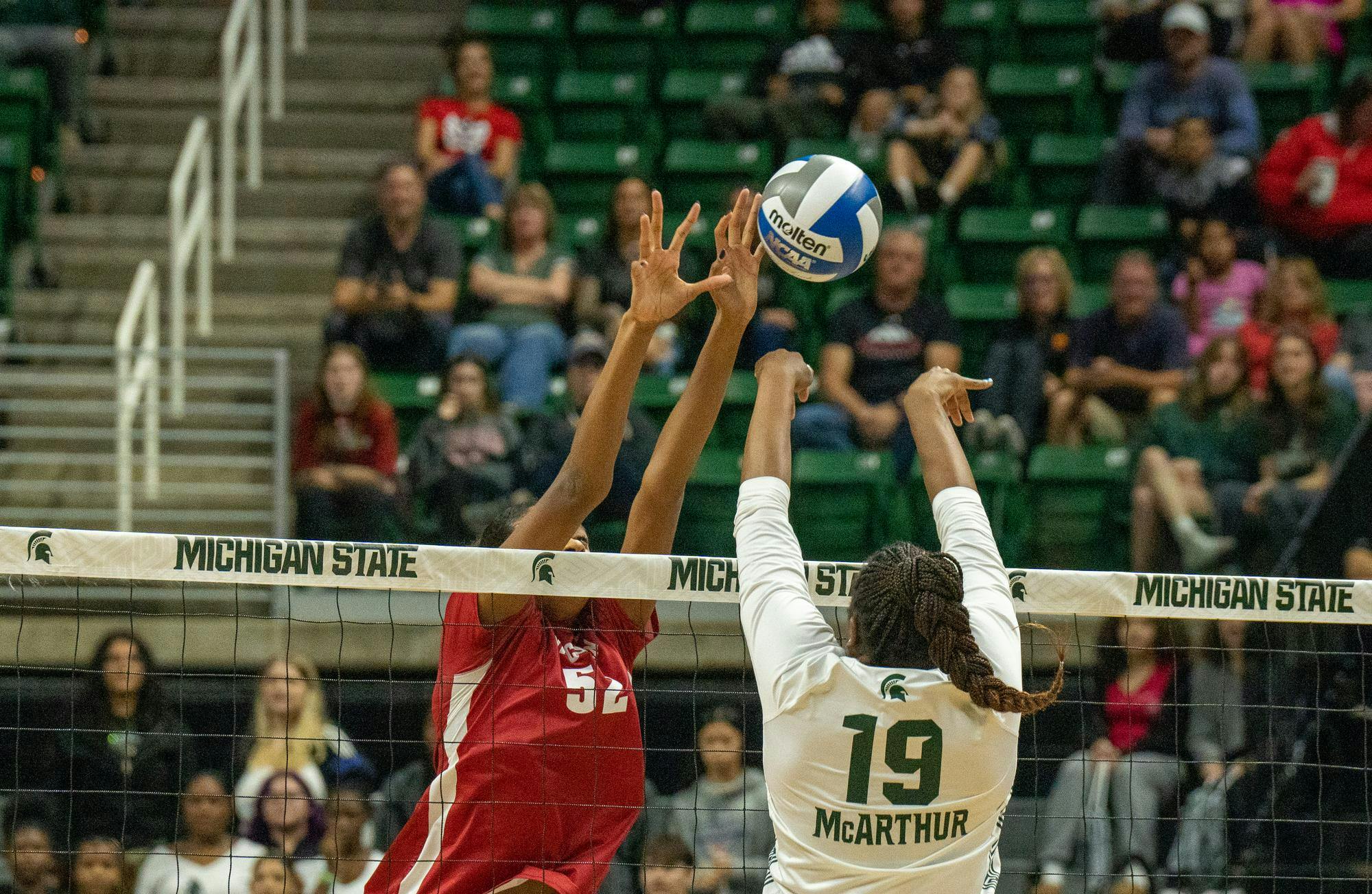 <p>Fifth-year Amani McArthur hits the ball to the opposing side during MSU volleyball's matchup against Wisconsin on Oct. 27, 2023 at the Breslin Center.</p>