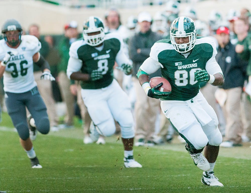 	<p>Senior tight end Dion Sims runs for the endzone on Saturday, Sept. 22, 2012 at Spartan Stadium. Sims contriubted one of two touchdowns in the Spartan&#8217;s 23-7 victory over <span class="caps">EMU</span>. James Ristau/The State News</p>