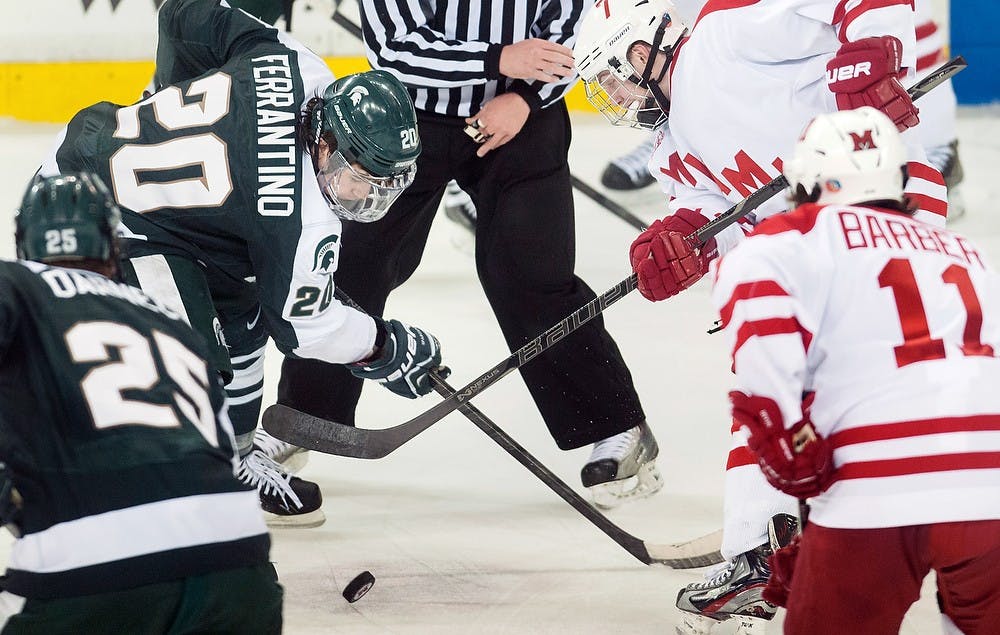 	<p>Freshman forward Michael Ferrantino faces off against Miami (Ohio) forward Austin Czarnik on Saturday, March 16, 2013, at Cady Arena of the Goggin Ice Center in Oxford, Ohio. <span class="caps">MSU</span> lost to Miami (Ohio) 4-1 in the second game of the second round of the <span class="caps">CCHA</span> playoffs. Danyelle Morrow/The State News</p>