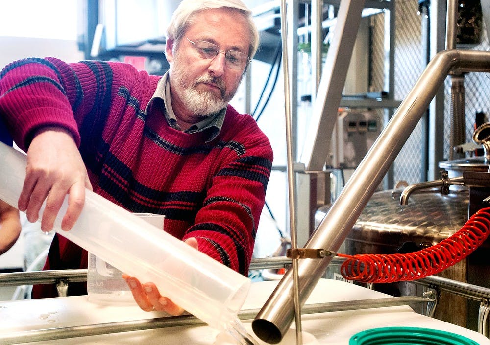 	<p>University distinguished professor of food science and chemical engineering Kris Berglund measures the volumetric flow of ethanol in the still to demonstrate in front of his class April 3, 2013, at  <span class="caps">MSU</span>&#8217;s Artisan Distilled Research Facility. <span class="caps">MSU</span> hopes to create a specialization in beverage technology beginning in the fall. Danyelle Morrow/The State News</p>