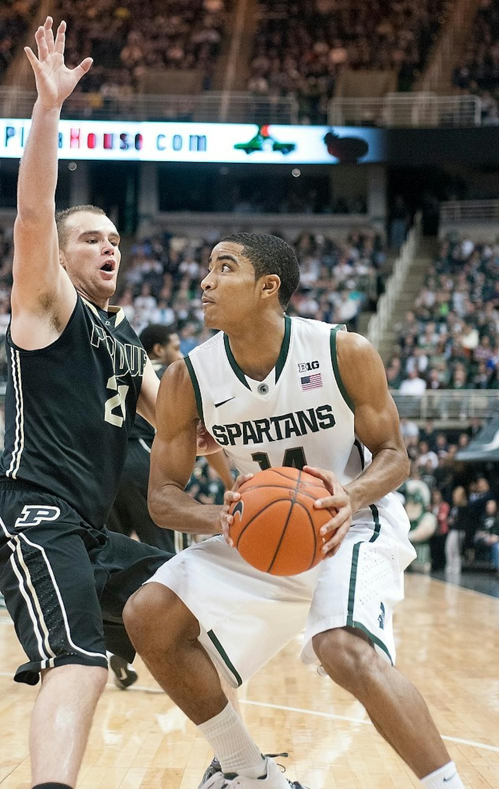 	<p>Freshman guard Gary Harris looks for a shot around Purdue guard/forward D.J. Byrd on Saturday, Jan. 5, 2013, at Breslin Center. Harris scored 22 points during the 30 minutes he played in the game. Danyelle Morrow/The State News</p>