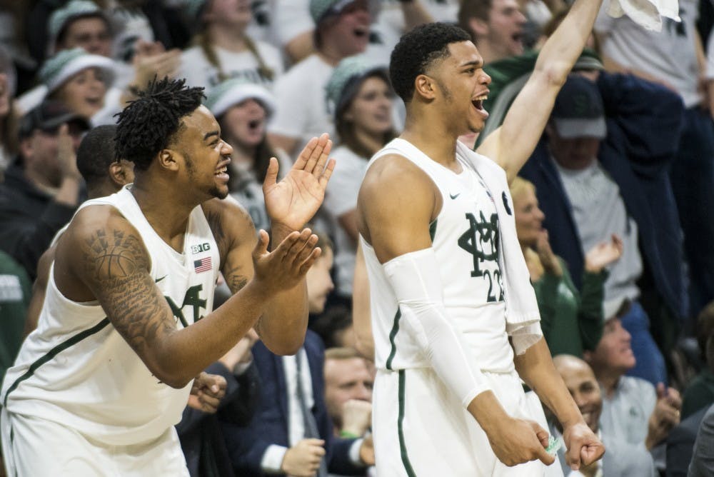 Freshman forward Nick Ward (44) and freshman guard and forward Miles Bridges (22) cheer during the men's basketball game against Minnesota on Jan. 11, 2017 at Breslin Center. The Spartans defeated the Golden Gophers, 65-47.