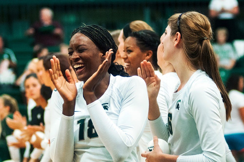 	<p>Senior middle blocker Alexis Mathews laughs after high-fiving fellow teammates before the game against Oregon, Sept. 6, 2013, at Jenison Field House. The Spartans defeated Oregon, 3-1. Danyelle Morrow/The State News</p>
