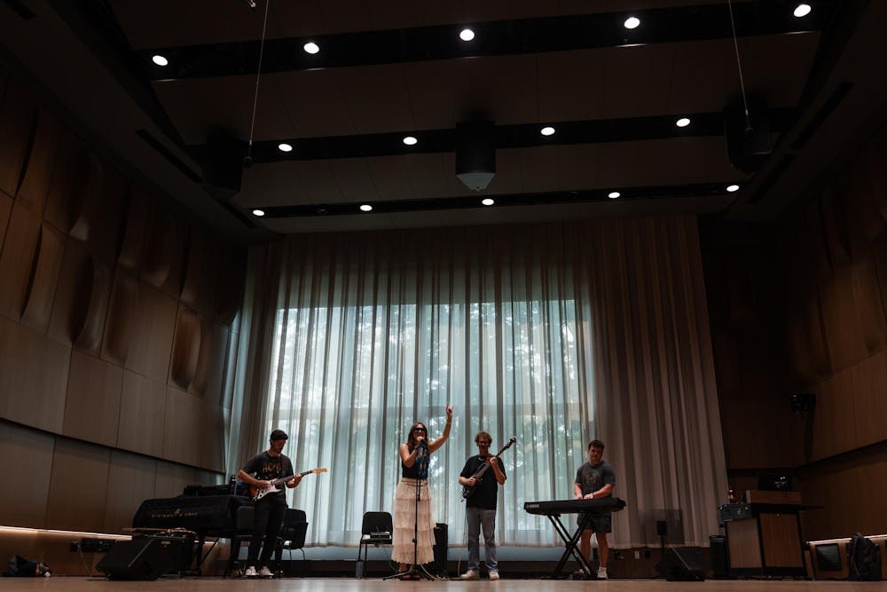 <p>Luke Karsten, Alina Morse, Kade Ringer and Kyle Quick (from left) practice for their band, Roxy Riot, at the MSU Music Building in East Lansing, Mich., on July 17, 2026.</p>