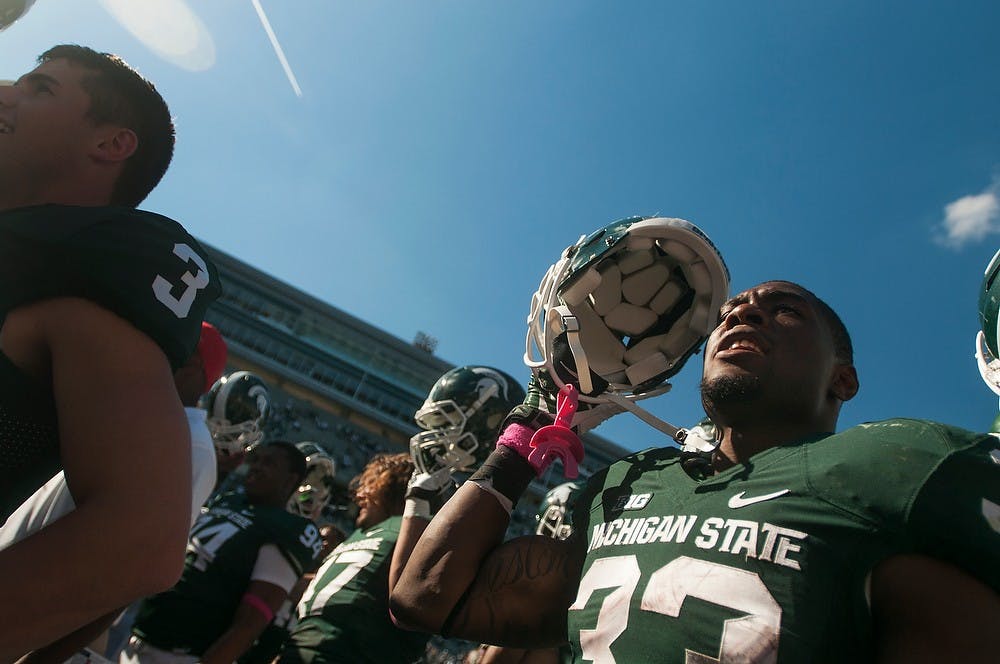 	<p>Junior running back Jeremy Langford celebrates with teammates after the game against Indiana, Oct. 12, 2013, at Spartan Stadium. The Spartans defeated The Hoosiers, 42-28. Danyelle Morrow/The State News</p>