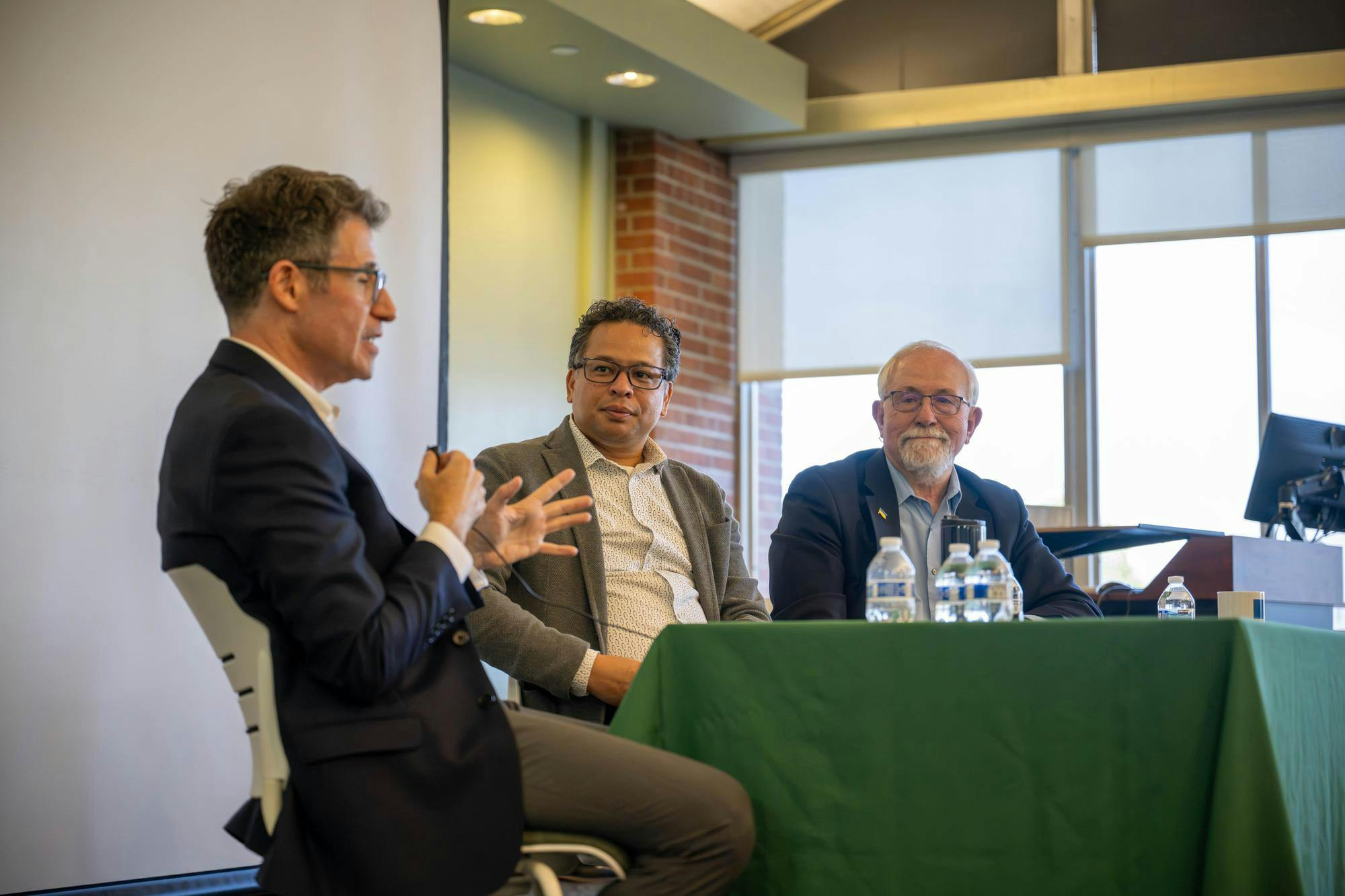 <p>Professor Norm Graham and Professor Robert Brathwaite listen as former CNN international correspondent and Michigan State University alumnus Marc Stewart speaks during a Q&amp;A event hosted by James Madison College at Michigan State University in East Lansing, Mich., on Monday, Sept. 14, 2026.</p>