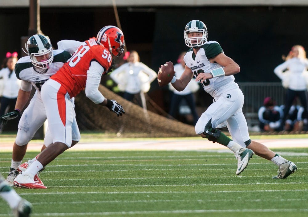 	<p>Sophomore quarterback Connor Cook looks to pass during the game against Illinois at Urbana Champaign, Saturday, Oct. 26, 2013, at Memorial Stadium in Champaign, Ill. The Spartans defeated the Fighting Illini, 42-3. Danyelle Morrow/The State News</p>