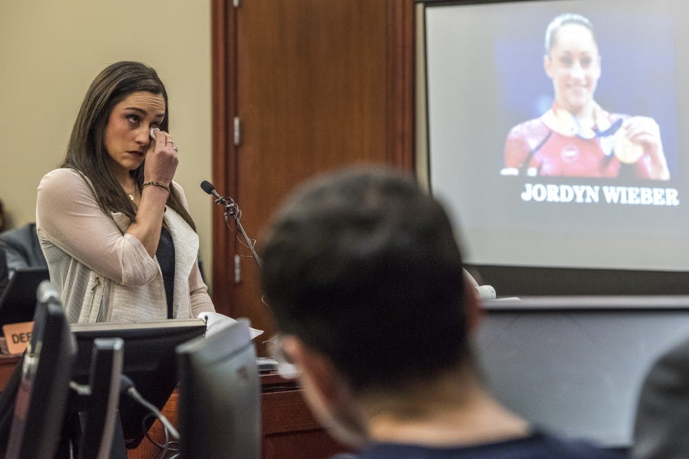 Olympic gold medalist and gymnast Jordan Wieber wipes away tears during her statement on the fourth day of ex-MSU and USA Gymnastics Dr. Larry Nassar's sentencing on Jan. 19, 2018 at the Ingham County Circuit Court in Lansing. (Nic Antaya | The State News)
