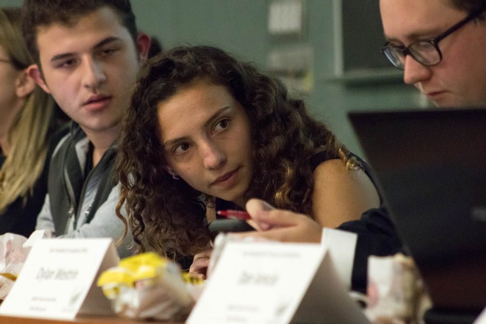 ASMSU President Katherine “Cookie” Rifiotis converses with other members during the General Assembly Meeting at the International Center on Sept. 20, 2018. Rifiotis is the spokesperson for MSU’s undergraduate students.