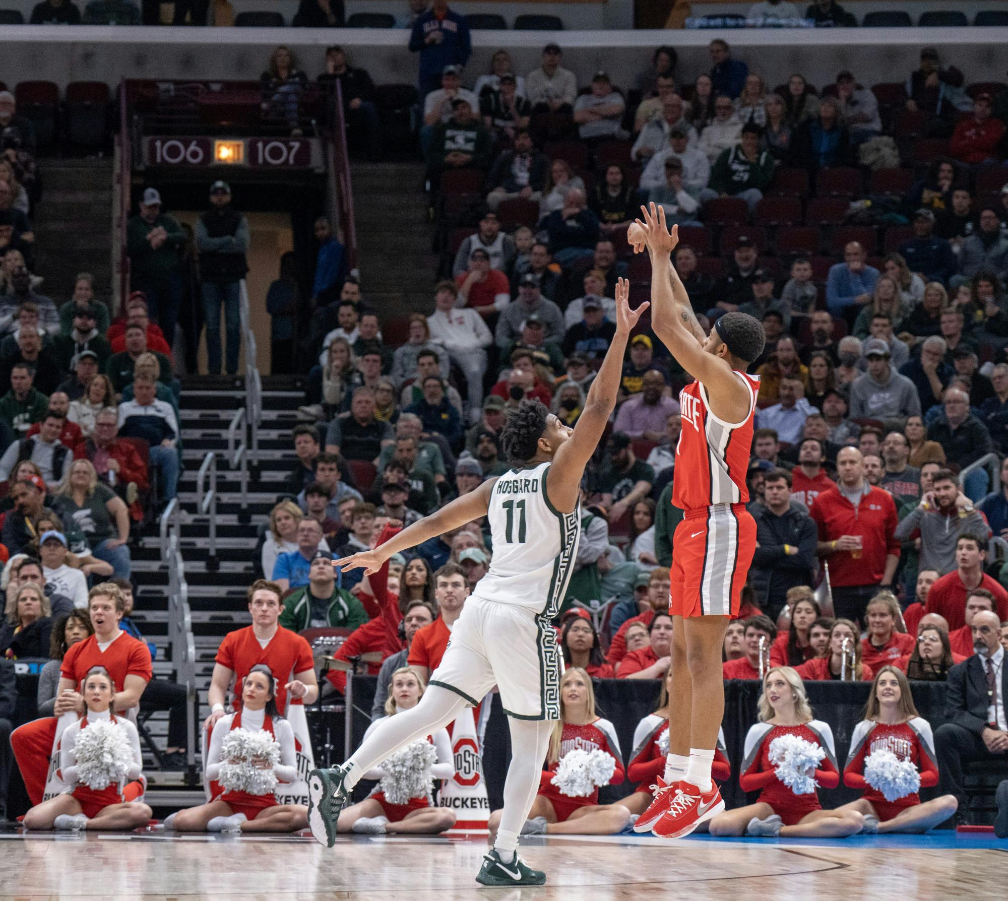 <p>Michigan State junior guard A.J Hoggard tries to block the shot of freshman guard Roddy Gayle Jr. on March 10, 2023.</p>