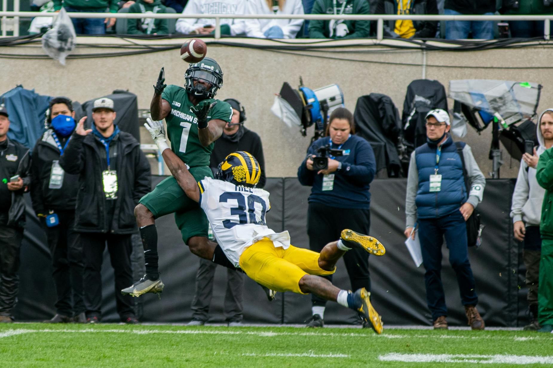 <p>Redshirt junior Jayden Reed hauls in a pass during the Spartans&#x27; 37-33 win against the Wolverines on Oct. 30, 2021.</p>