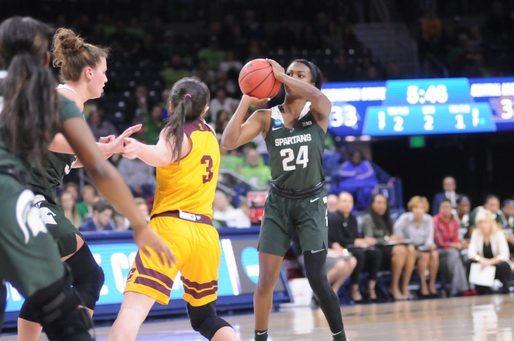 <p>Then-freshman guard Nia Clouden (24) shoots the ball while Central Michigan guard Presley Hudson (3) defends her on March 23, 2019.</p>