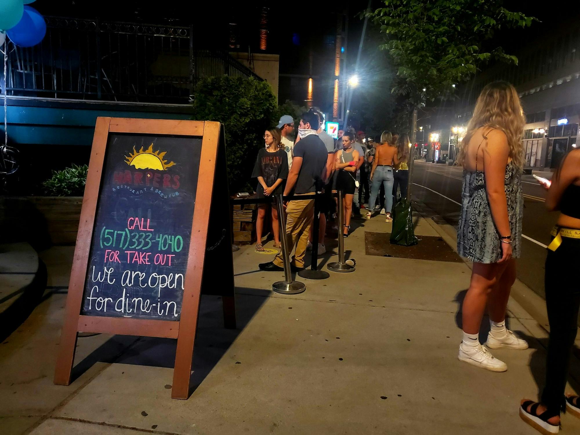 <p>The line at Harper&#x27;s Restaurant and Brewpub on June 8 following Michigan&#x27;s reopening of bars and restaurants at 50% capacity.</p>