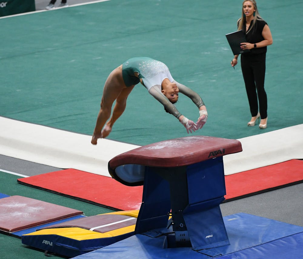 Junior Lea Mitchell during her vaulting routine at gymnastics meet at Jenison Field House on February 16, 2020. The Spartans took the win over the Fighting Illini. 