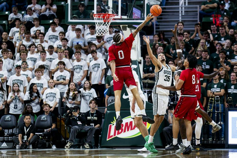 <p>Incarnate Word forward D'Arrae Goodwin (0) goes up for a basket as Michigan State forward Jesse McCulloch (35) blocks during the Michigan State vs. Incarnate Word men's basketball exhibition game at Breslin Center in East Lansing, Mich., on Friday, Oct. 2, 2026.</p>