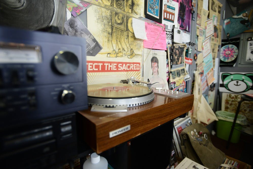 A record player plays a record on March 15, 2016 at The Record Lounge 111 Division St. in East Lansing.