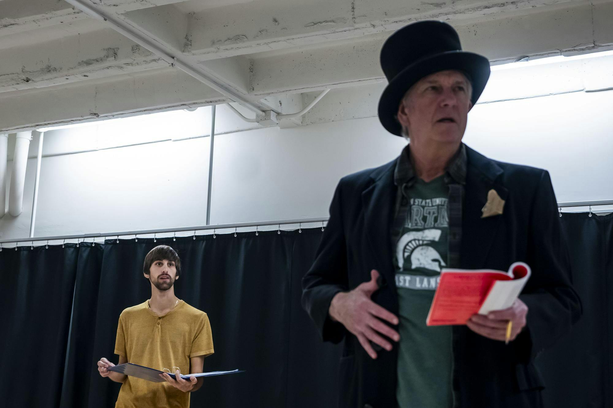 <p>Michigan State acting senior Karam Mawazini and Williamston Theater actor John Lepard rehearse for their upcoming play “A Sherlock Carol” in the Auditorium Building in East Lansing, Michigan on Oct. 28, 2025.</p>