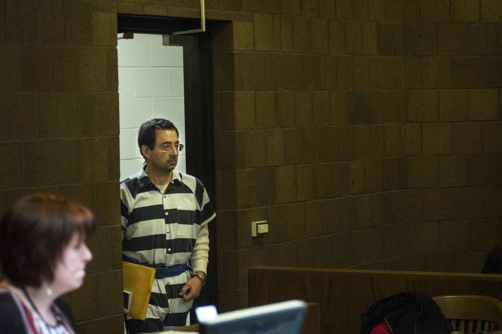 Former MSU employee Larry Nassar enters the court before a pretrial hearing begins on Feb. 17, 2017 at 55th District Court in Mason, Mich. The hearing occurred as a result of former MSU employee Larry Nassar's alleged sexual abuse.