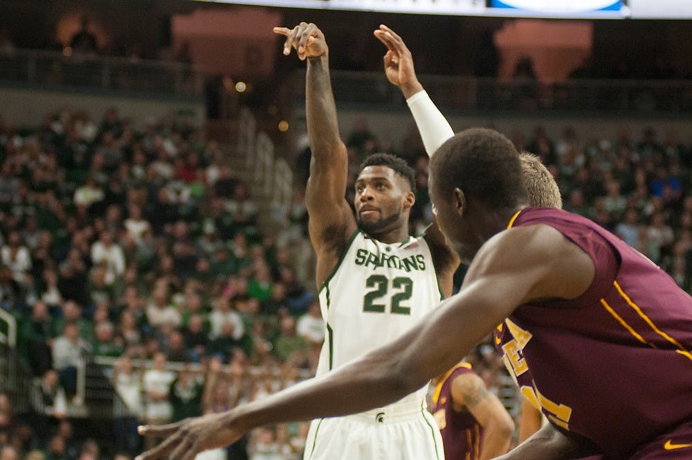 <p>Senior guard/forward shoots a free throw Feb 26, 2015, during the game against Minnesota at Breslin Center. The Spartans fell to the Golden Gophers during overtime 96-90. Kennedy Thatch/The State News</p>