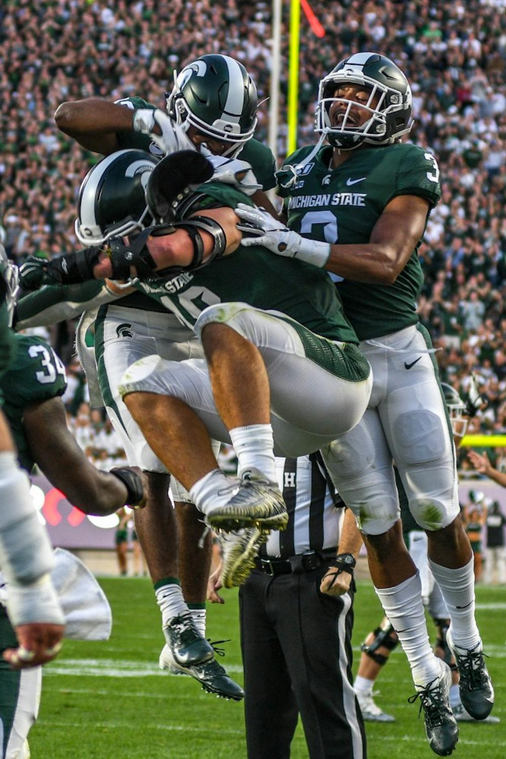 The Spartans celebrate during the game against Tulsa on Aug. 30, 2019 at Spartan Stadium. The Spartans defeated the Golden Hurricane, 28-7.