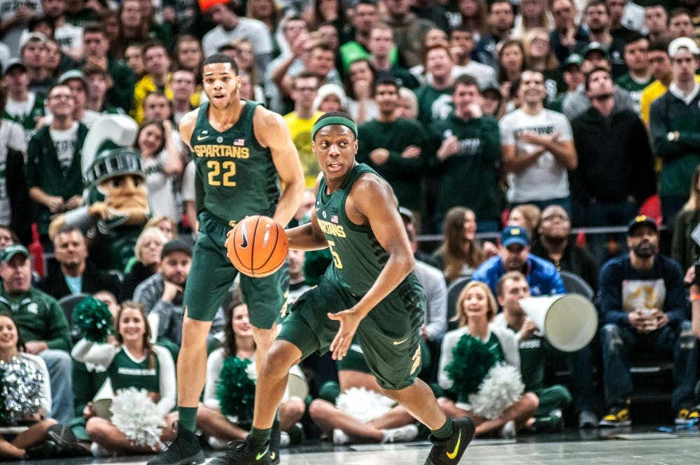 Sophomore guard Cassius Winston (5) dribbles up the court during the game against Oakland, on Dec. 16, 2017, at Little Caesar's Arena. The Spartans defeated the Golden Grizzlies, 86-73.