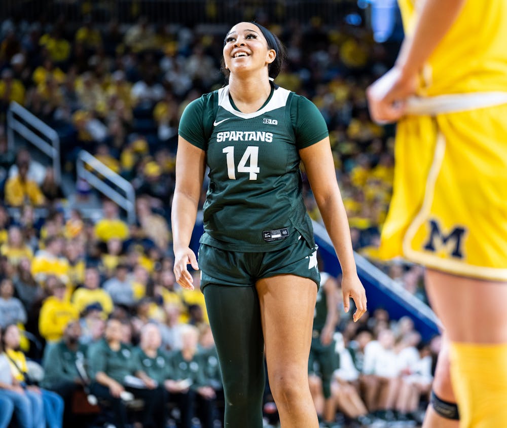 <p>Senior forwards Taiyier Parks (14) smiles after shooting a free throw during a game against Michigan at the Crisler Center on Jan. 14, 2023. The Spartans lost to the Wolverines 70-55. </p>