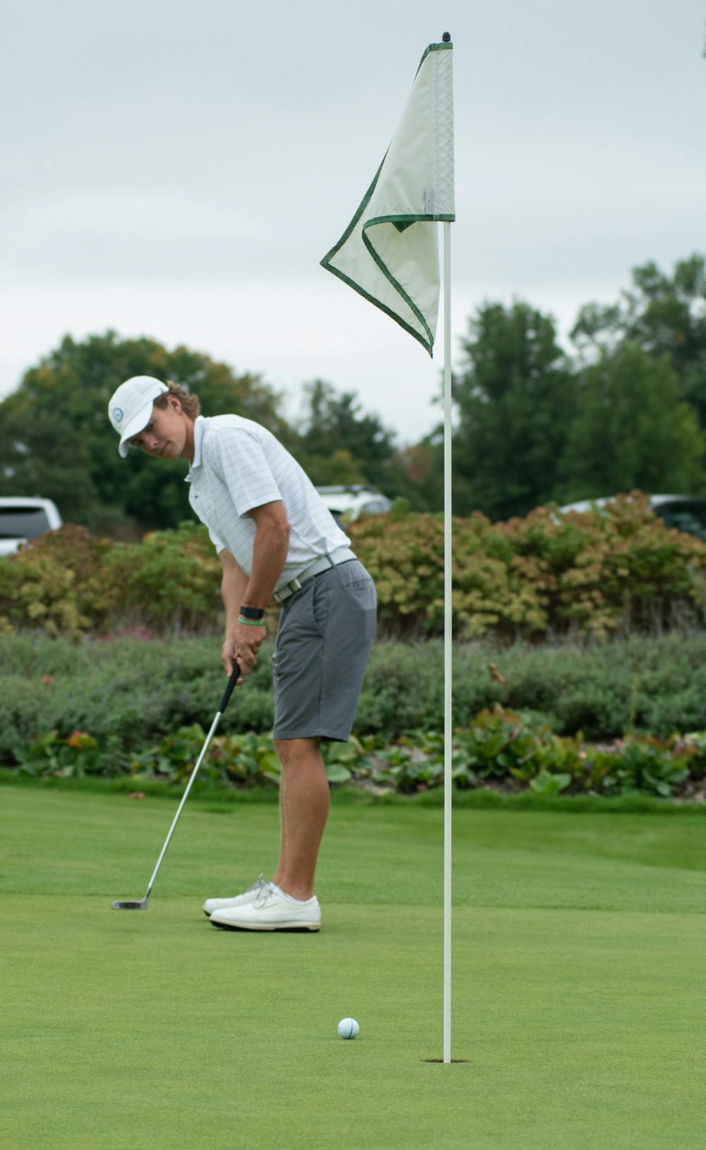 <p>James Piot putts at Lasch Family Golf Center on Sept. 21, 2021.</p>