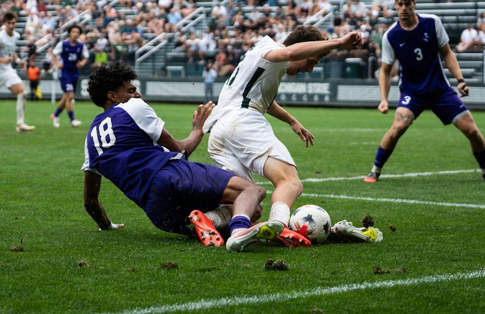 <p>MSU sophomore midfielder, Peter Soudan (17) falls over Niagara junior back, Chase Dade (18) at DeMartin Stadium in East Lansing, Mich., on Sunday, Aug 30, 2026.</p>