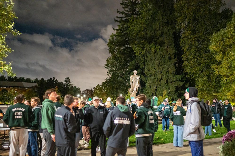 Members of the Spartan Marching Band take part in Sparty Watch at Michigan State University in East Lansing, Mich., Tuesday, Oct. 22, 2025.