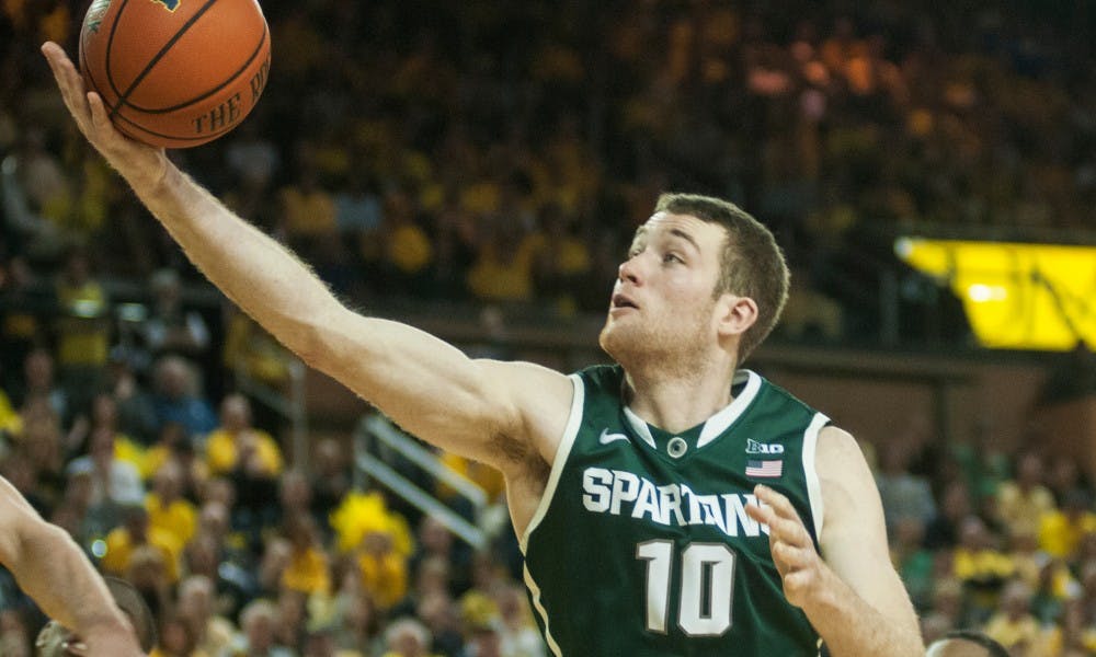 Sophomore forward Matt Costello grabs a rebound during the game against Michigan on Feb. 23,  2014, at Crisler Center in Ann Arbor, Mich. The Spartans were defeated by the Wolverines, 79-70. Danyelle Morrow/The State News