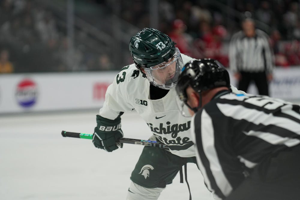 <p>Michigan State forward Tiernan Shoudy (13) gets ready for a faceoff against Wisconsin at Munn Ice Arena on Nov. 17, 2023.</p>