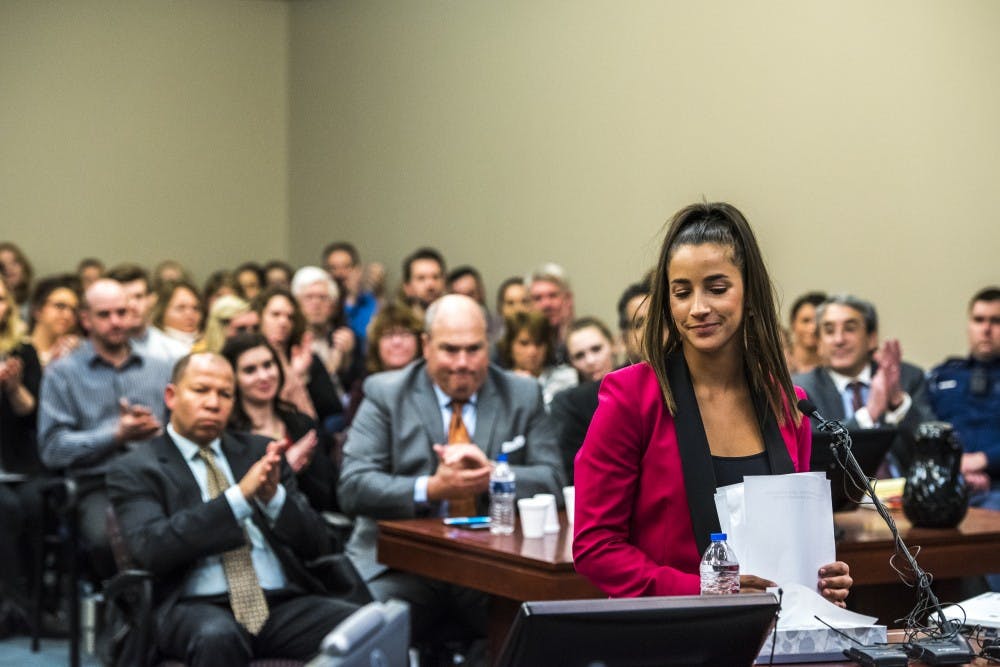 The courtroom claps after six-time Olympic medal winner Aly Raisman addressed Ex-MSU and USA Gymnastics Dr. Larry Nassar in her statement on the fourth day of Nassar's sentencing on Jan. 19, 2018 at the Ingham County Circuit Court in Lansing. (Nic Antaya | The State News)