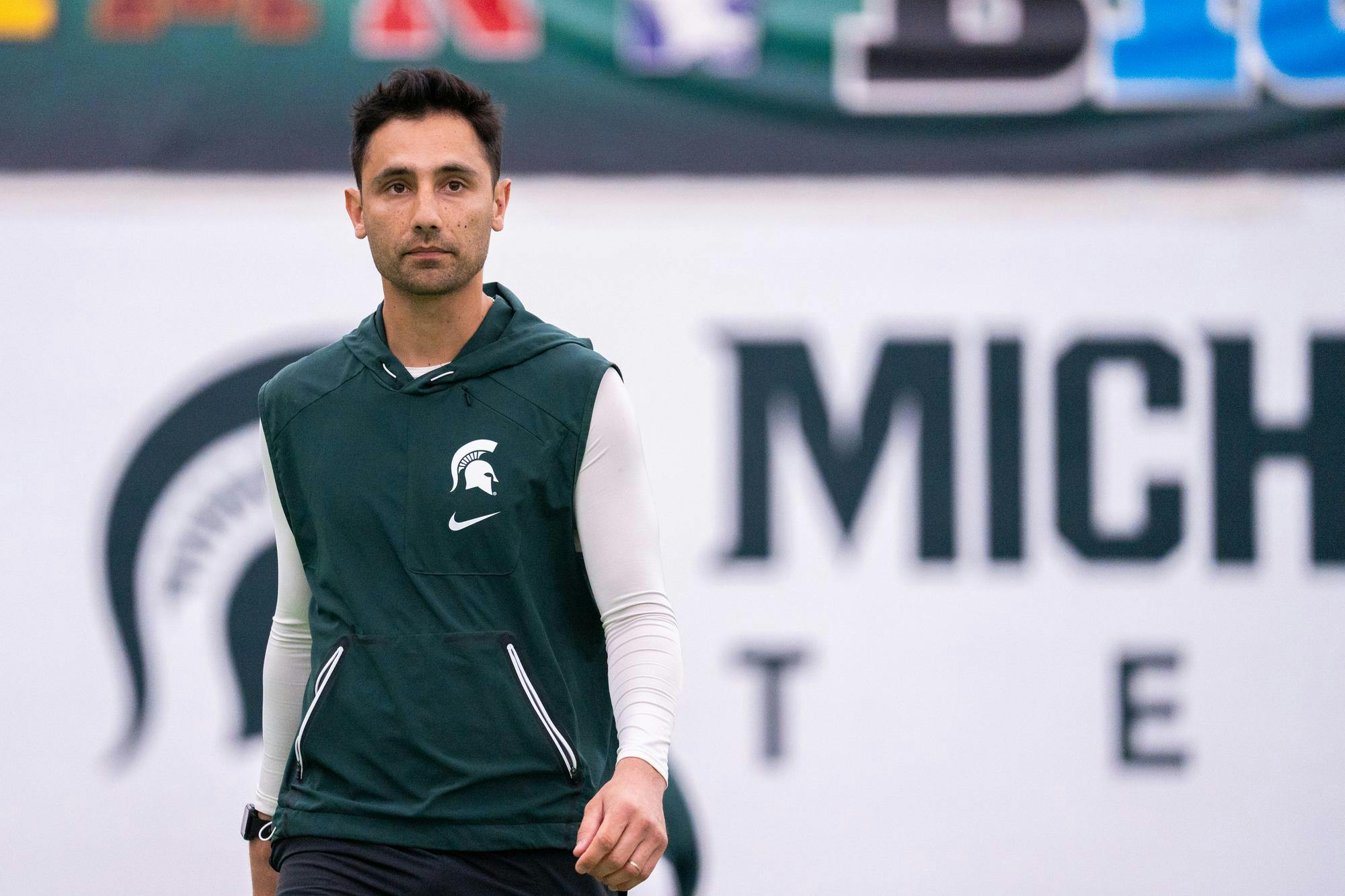 MSU Men’s Tennis head coach Harry Jadun walks onto one of the courts before a match against Ball State at the MSU Tennis Facility on Feb. 2, 2024.