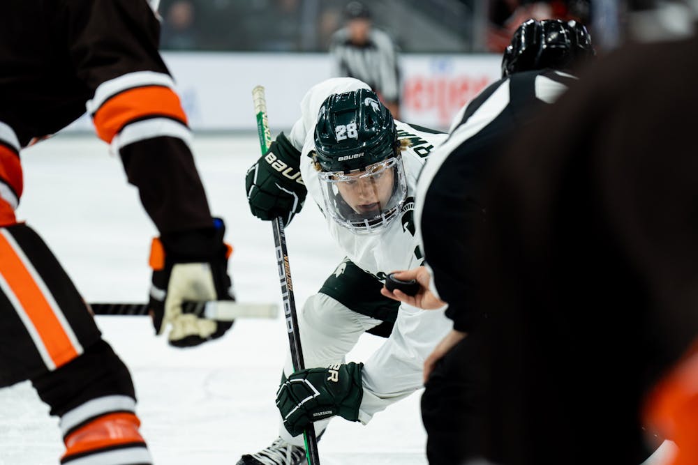 <p>Freshman forward Karsen Dorwart (28) prepares for a face-off during a game against Bowling Green State University at Munn Ice Arena on Oct. 7, 2022. The Spartans lost against the Falcons with a score of 3-1. </p>
