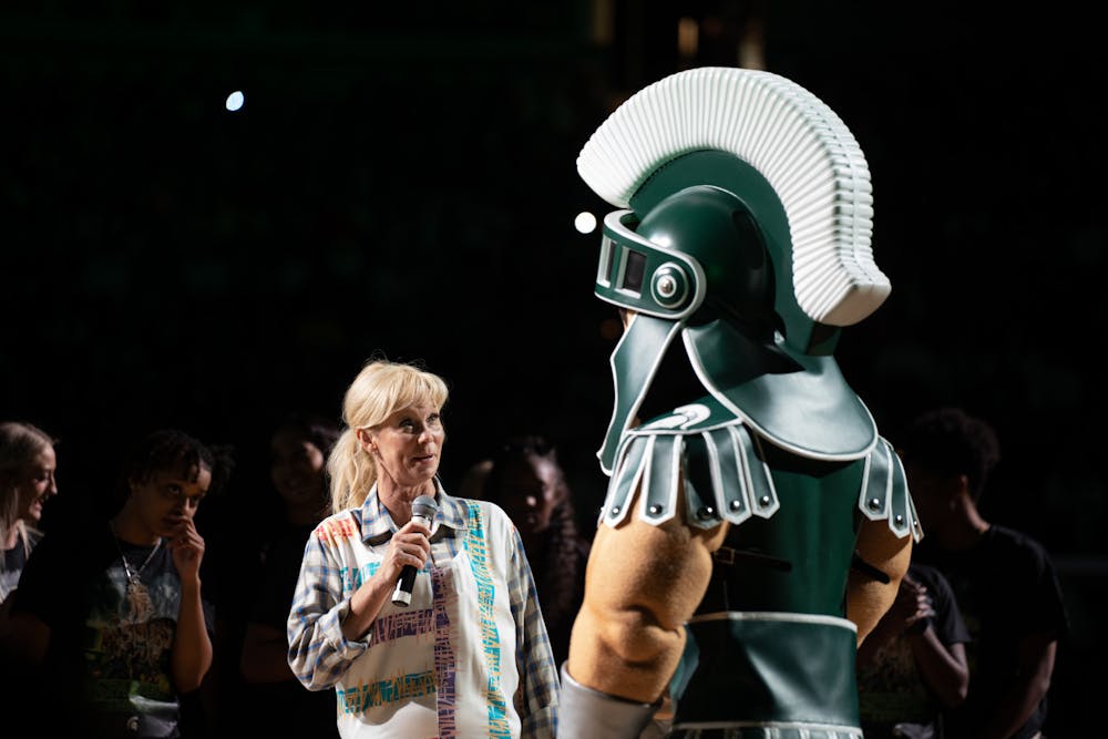 <p>Women&#x27;s basketball head coach ﻿Suzy Merchant chatting with sparty.</p>