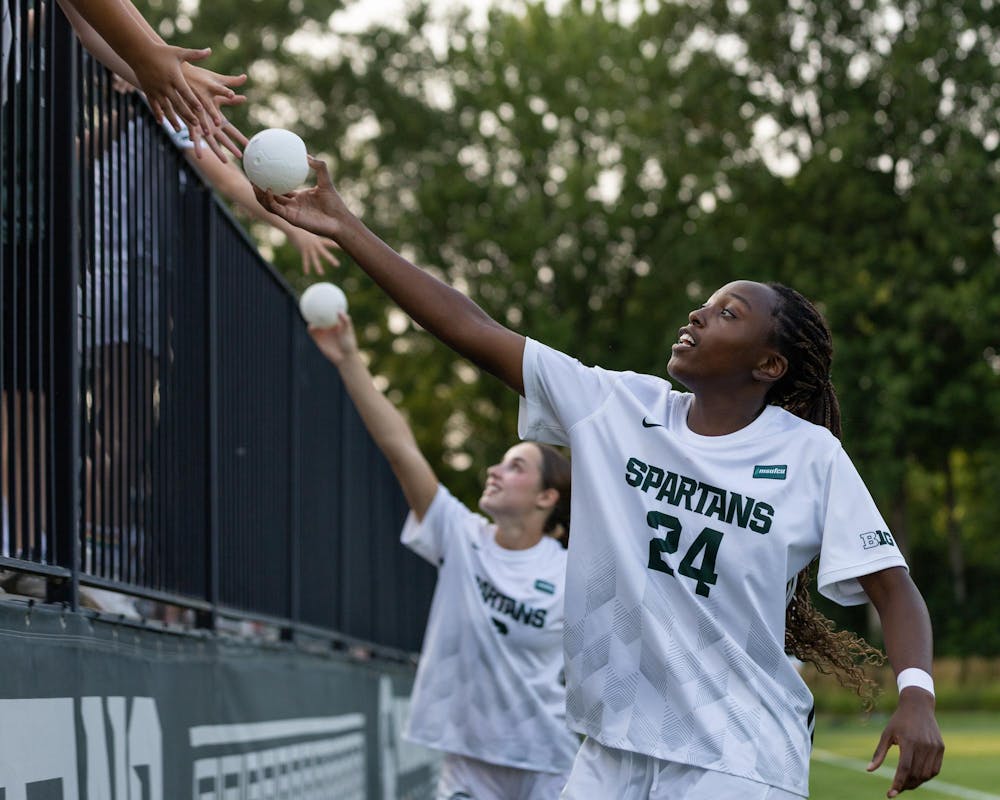 <p>Michigan State women's soccer Sr. F Kennedy Bell (24) along with the rest of the starting XI hands small soccer balls to fans in the stands to show appreciation in DeMartin Stadium in East Lansing, Mich., on Aug. 12, 2026.</p>