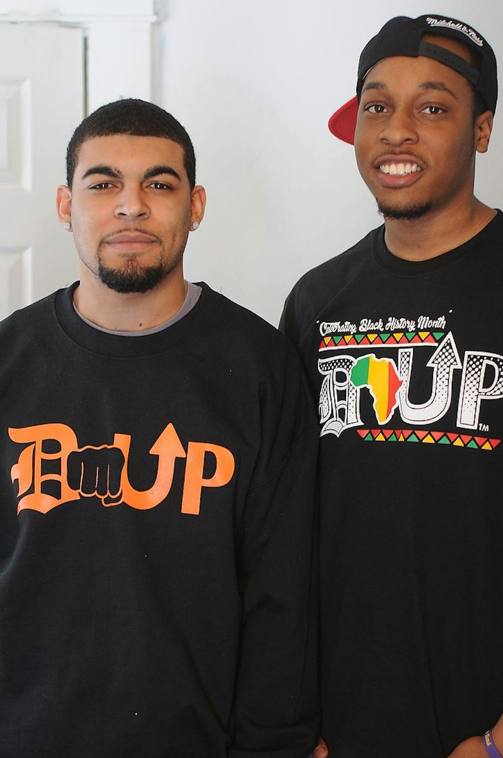 <p>Media and information junior Derek Thompson and food industry management junior Edward Davis pose Feb. 17, 2015, at their apartment in Lansing. The goal of their company, Rejeunir Productions, is to help rejuvenate the city of Detroit and eventually open a recording studio.  Alice Kole/The State News</p>