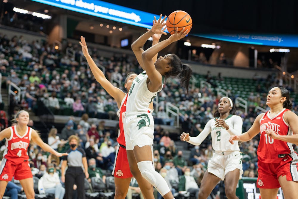 <p>Senior guard Nia Clouden (24) goes for a shot. The Spartans lost 61-55 against Ohio State University at the Breslin Center on Feb. 27, 2022.</p>